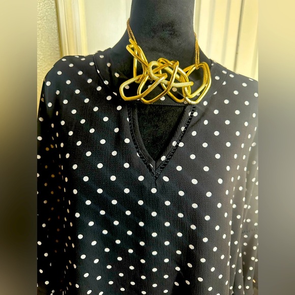 Brand: NAIF, black dress, with white dots, and flared sleeves - Picture 3 of 12